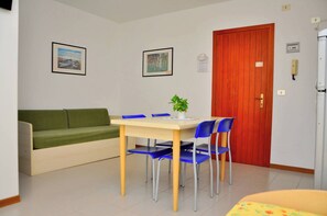 Studio, Balcony, Ocean View | Dining room - Elegant and Bright Studio Apartment Near the Beach (San Michele al Tagliamento)