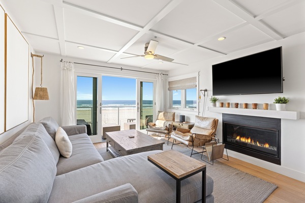Bright and minimalist, this welcoming space is thoughtfully furnished with contemporary pieces in soft fabrics and warm hues, offering comfortable seating, a Smart TV, and expansive windows overlooking the Pacific Ocean.