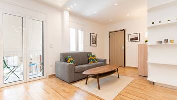 Superior Apartment | Living area | 43-inch Smart TV with cable channels