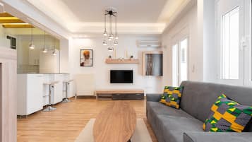 Superior Apartment | Living area | 43-inch Smart TV with cable channels