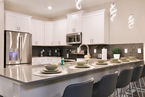 Fridge, microwave, oven, stovetop - 9 Bedroom waterfront pool home in Storey Lake Resort (Kissimmee)