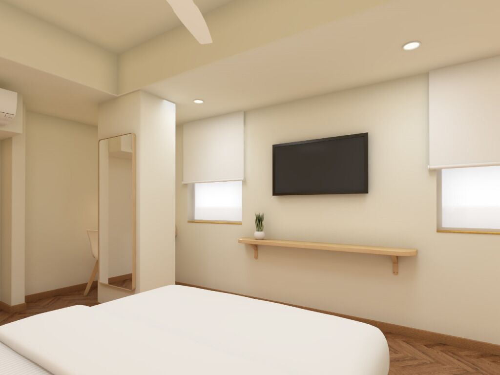 Une chambre moderne avec un grand lit, un téléviseur fixé au mur et des étagères intégrées.