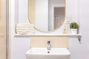 Hair dryer, towels, soap, shampoo