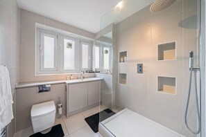 Shower, hair dryer, towels, soap