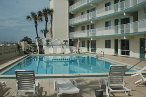 Outdoor pool, pool umbrellas, sun loungers