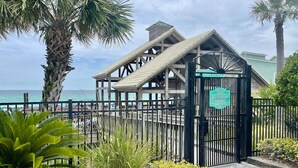 A beach pavilion entrance with a sign indicating it is for children and dinner cruises only. - Steps to ocean/Pvt Beach & Access Ramp/2 Pools/17 guests (destin)