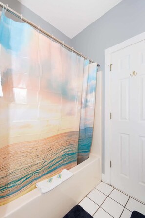 Shower, hair dryer, towels, shampoo