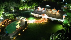 A well-lit residential property with a swimming pool, a covered patio, and a landscaped garden. - The Lauren Taylor Villa - Tobago


 (Lowlands)