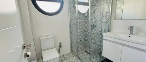 Shower, towels, soap, toilet paper