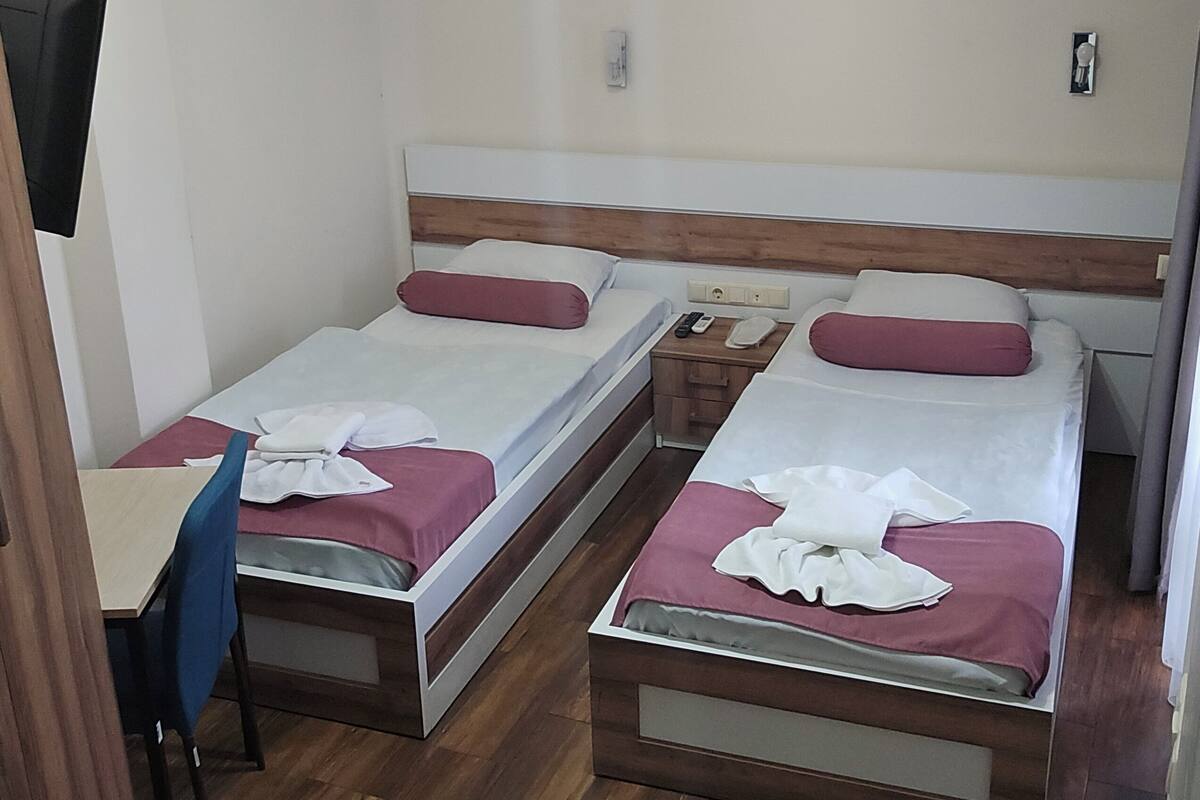 Premium bedding, down duvets, desk, laptop workspace