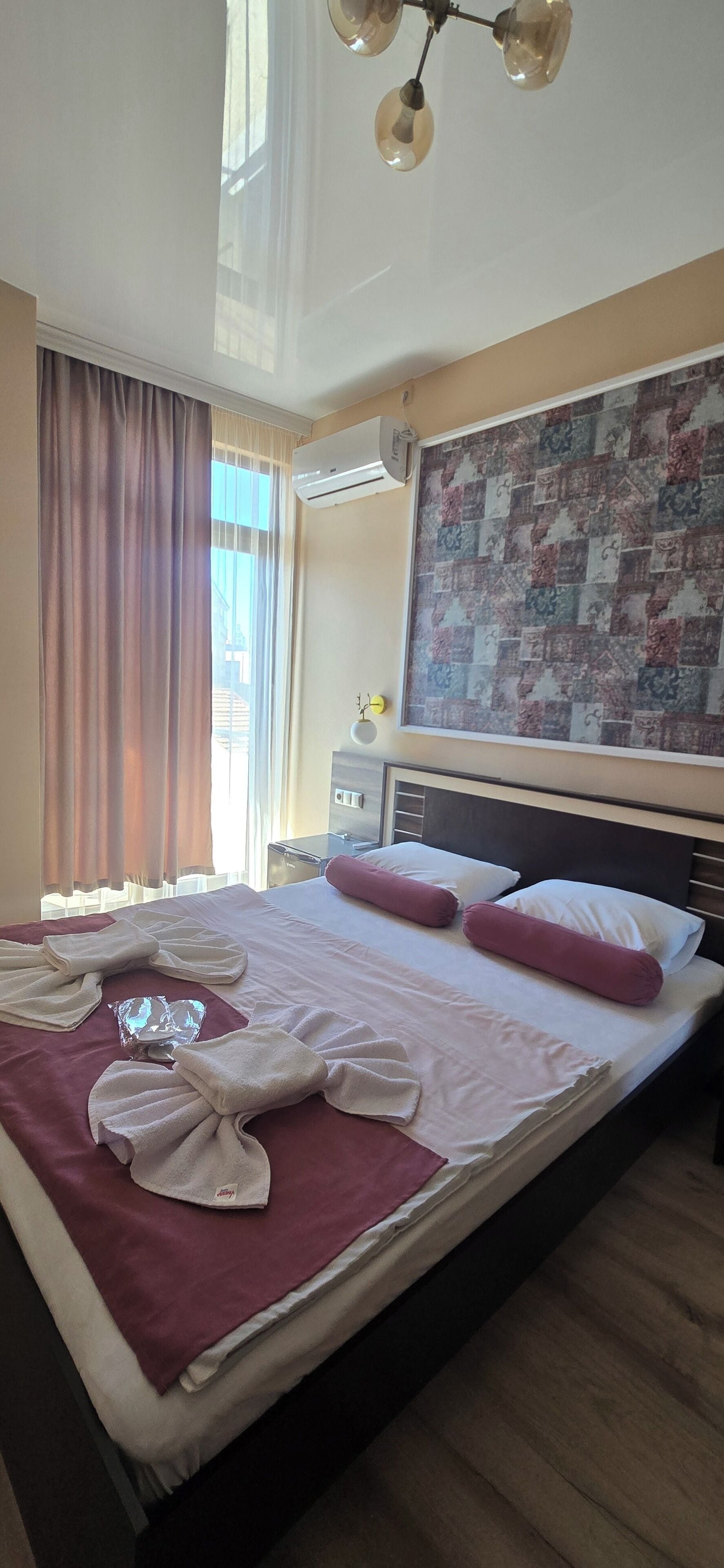 Premium bedding, down duvets, desk, laptop workspace