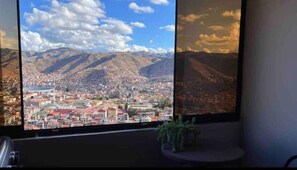 Enjoy breathtaking views of the city and mountains from this room.