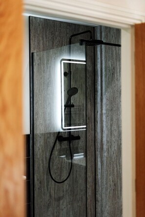Shower, eco-friendly toiletries, hair dryer, towels