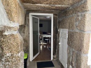 Enter a cozy room with a dining area and a radiator.