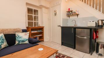 Fridge, electric kettle, cookware/dishes/utensils