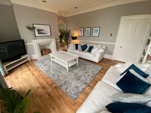 TV, fireplace, books - Waimea House | Beach Front | The best sea views (North Yorkshire)