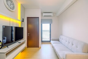 Apartment | Living area - Homey And Modern Look 2Br Transpark Cibubur Apartment (Depok)