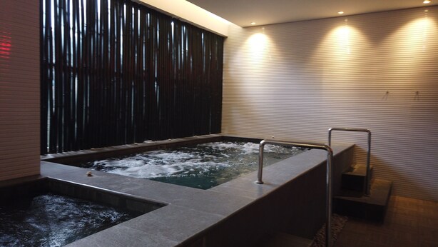 A modern spa area with a hot tub and a separate water feature. - Good Deal And Homey Studio Azalea Suites Apartment Cikarang (Cikarang)