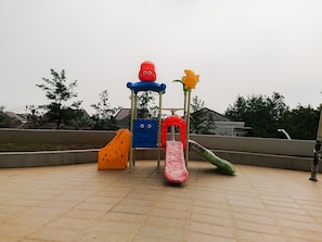 A playground with slides and climbing structures.