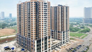 A high-rise residential building with multiple floors and balconies, surrounded by a cityscape and greenery. - Best Deal And Cozy 3Br Meikarta Apartment (Cikarang)