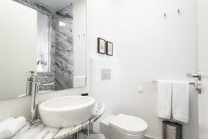 Superior Room | Bathroom | Hair dryer, towels, soap, shampoo