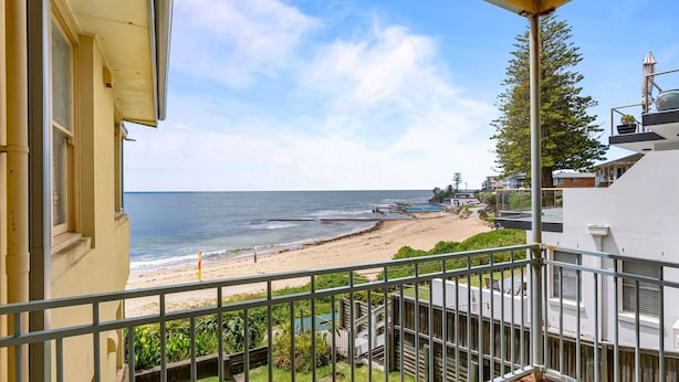 A balcony with a view of a beach and ocean. - Golden-Sands- 3-66-Ocean-Pde (The Entrance)
