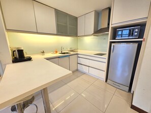 Fridge, microwave, stovetop, cookware/dishes/utensils