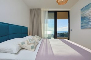 A bedroom with a bed, a view of the outdoors, and a painting on the wall. - Hedera Estate, Hedera A44 (Dubrovnik)