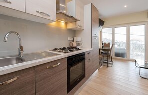 Fridge, stovetop, cookware/dishes/utensils