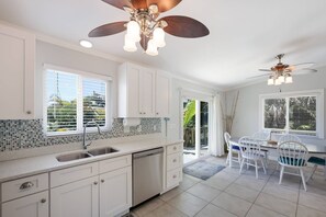 Fridge, microwave, oven, stovetop - Island Girl East – Coastal Retreat w/ Pool, Deck & Short Walk To Beach (Holmes Beach)