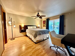 Relax in comfort with a large bed and a desk for work.