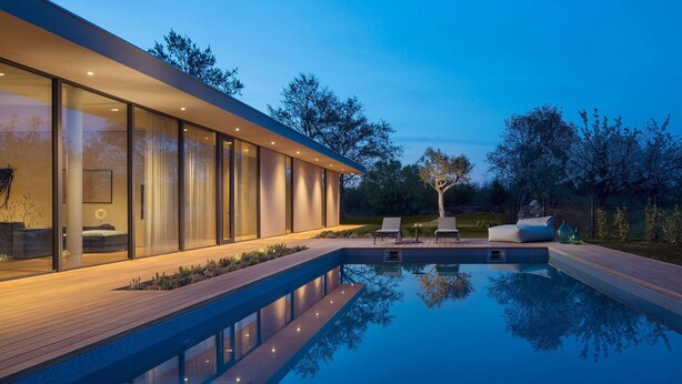 A modern house with a swimming pool, glass walls, and outdoor seating. - Stunning home in Vodnjan with sauna (Vodnjan)