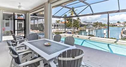 Canal-front home with private pool, pool spa, dock, boat access, grill, gym, W/D