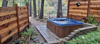 Dog-friendly lakefront cabin with canoes, athletic courts, grill, & horse stable