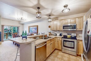 Fridge, microwave, oven, stovetop - Comfortable mountain view condo with gas fireplace, W/D, & patio (Fraser)