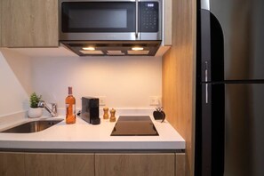 Fridge, microwave, stovetop, coffee/tea maker