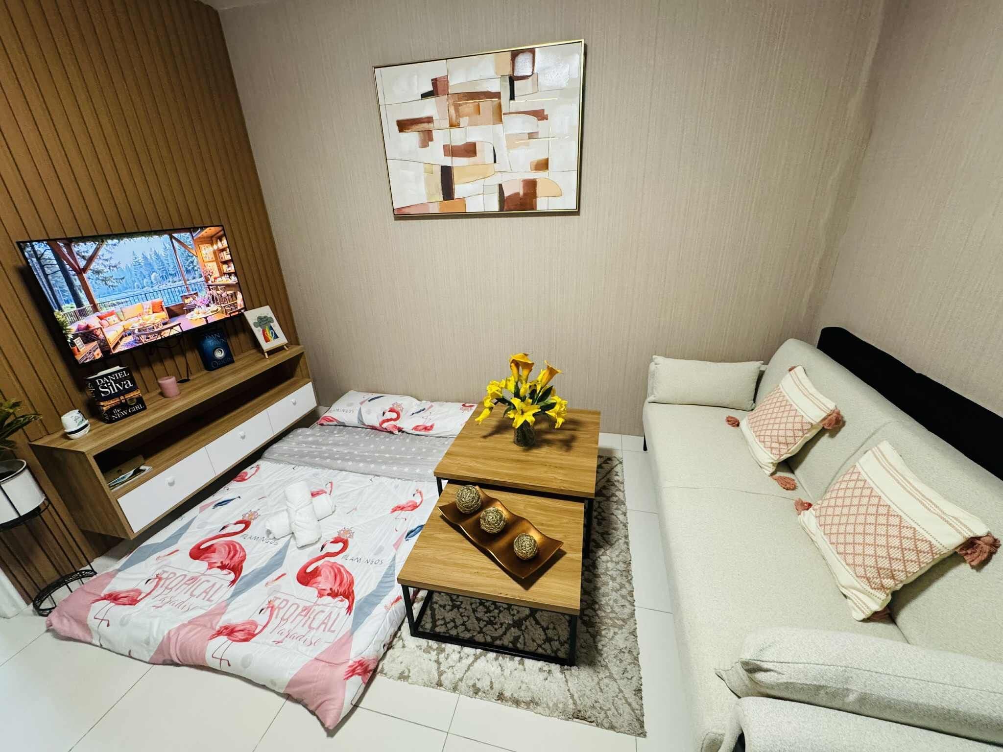 Business Condo | Living area | 55-inch LCD TV with digital channels, Netflix, streaming services