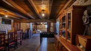 A cozy room with a foosball table, wooden furniture, stone walls, and a vintage radio. - Awesome home in Polaca (Polaca)