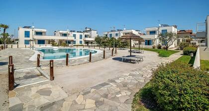 Apartment 'Blu Village' with Shared Pool, Private Terrace, and Air Conditioning
