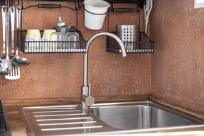 Fridge, stovetop, coffee/tea maker, cookware/dishes/utensils
