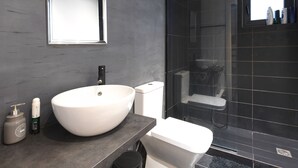 A modern bathroom with a large white sink, a mirror, and a shower area. - 200mb Fibre Remote Workers' Dreamhouse (Athens)