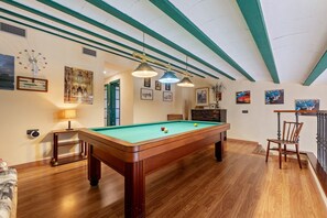 A pool table in a room with wooden flooring, green-painted ceiling beams, and wall-mounted artwork. - Vacation Home "Mas Lucena" with Private Pool, Private Terrace & Wi-Fi (Alforja)