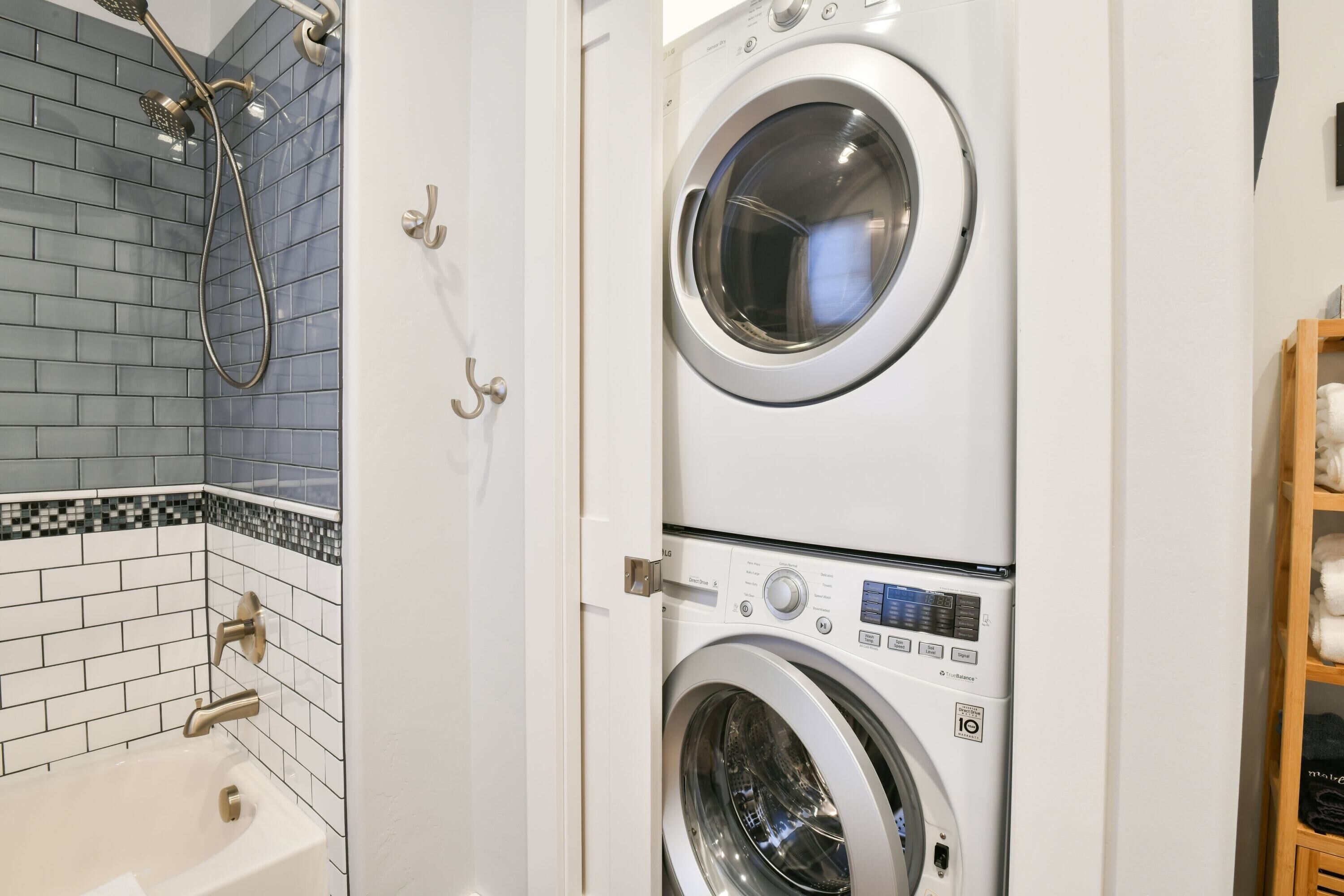 Shower, hair dryer, towels, toilet paper