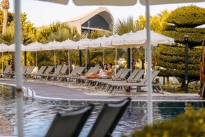 Indoor pool, seasonal outdoor pool, pool umbrellas, pool loungers