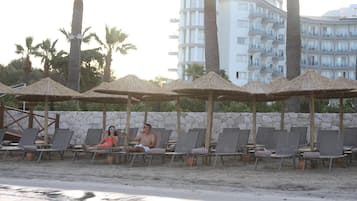 Sun loungers, beach umbrellas, beach towels, beach volleyball