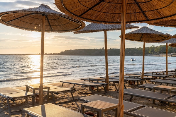 Sun-loungers, beach umbrellas, beach towels, beach volleyball