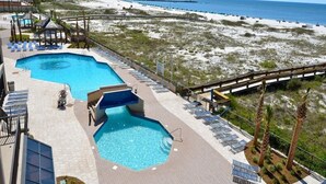 A pool area with a clear view of the beach and ocean. - Snowbird Availability!  Beachfront 3BR!!  Inquire for best Rates! (Orange Beach)