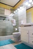 Shower, rainfall showerhead, towels, soap