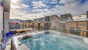 A hot tub with a view of a snowy mountain and a clear sky. - Silverthorne Townhome w/ Hot Tub: Walk to Town! (Silverthorne)
