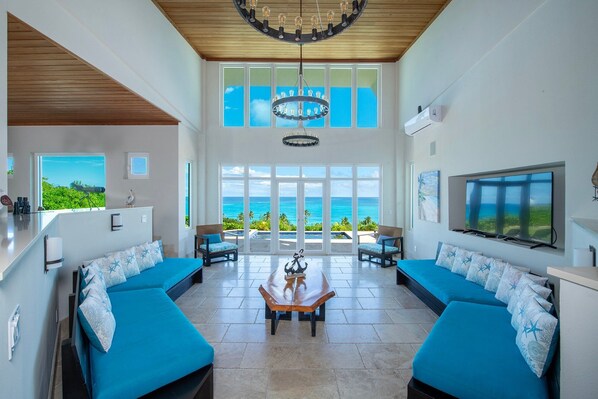 TV, books, offices - Sky Beach Club Vine House - Contemporary Beach Villa, Pool (Governors Harbour)